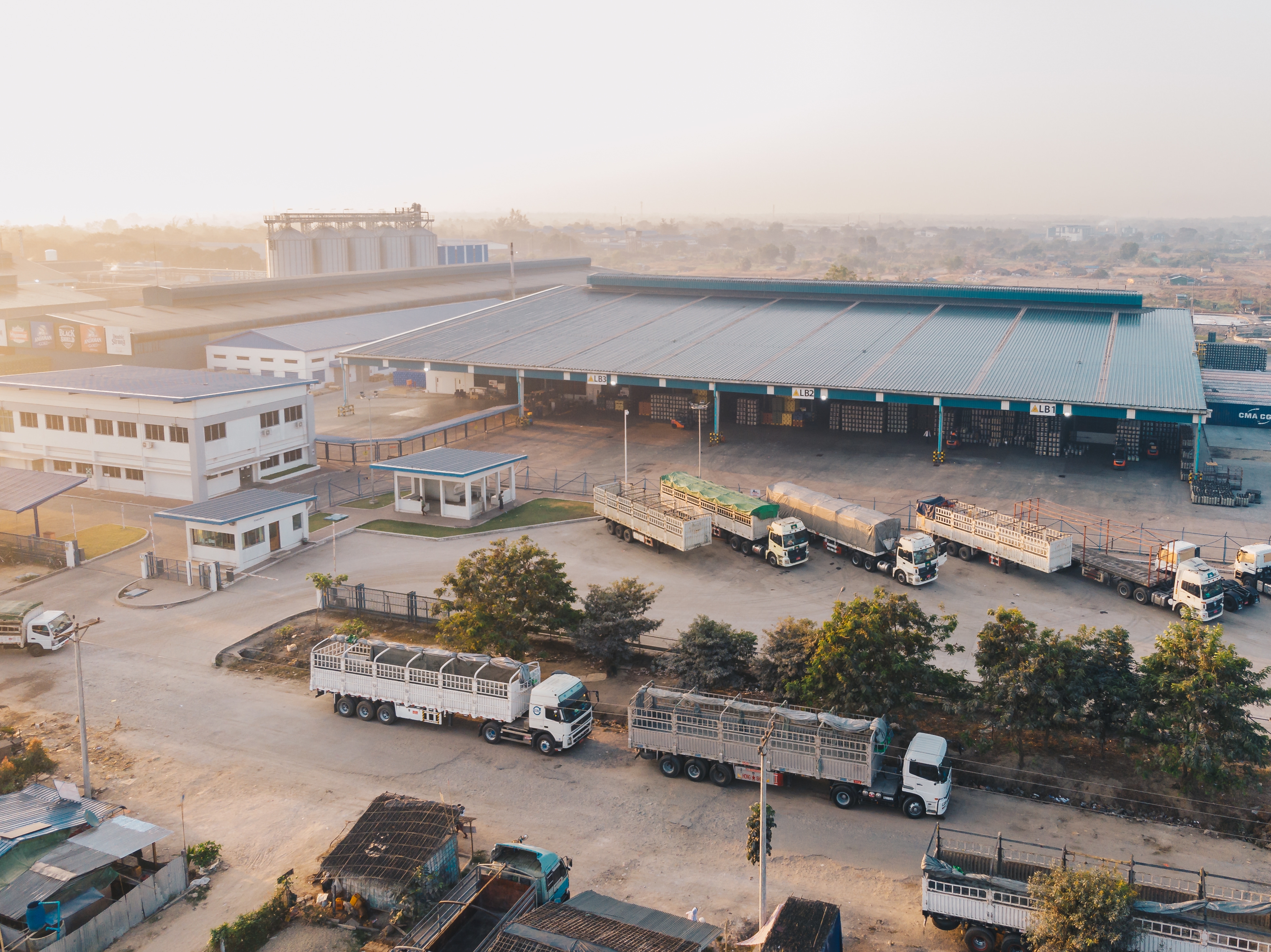 Aerial view of warehouse with parked trucks, illustrating Mehta Interstate Transport Corporation’s logistics operations